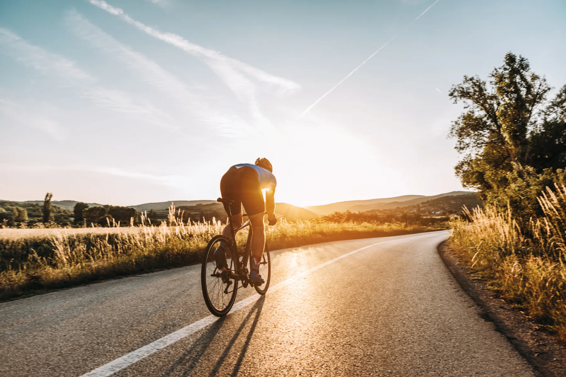 Biking through the neighborhood at sunset